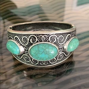 Silver cuff bracelet with turquoise stones